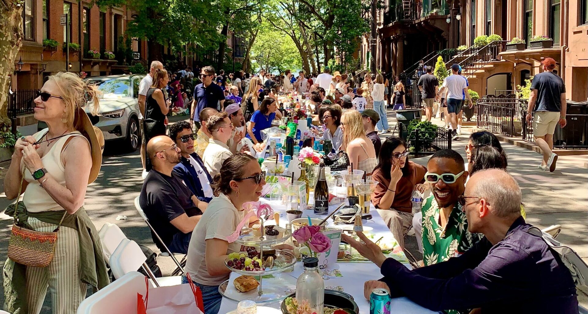 Roughly 1,300 people gathered at tables along Remsen Street and Montague Terrace in Brooklyn Heights for Saturday’s Longest Table 2026 pot luck. Photo: Mary Frost/Brooklyn Eagle