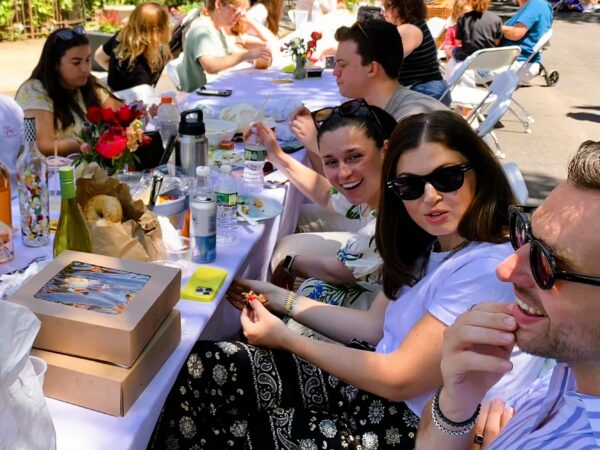 Menus at Saturday’s Longest Table 2026 ranged from the sublime to deli bagels. Photo: Mary Frost/Brooklyn Eagle