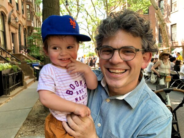 Councilmember Lincoln Restler with son Elliot — obviously a big fan of the Longest Table. Photo: Mary Frost/Brooklyn Eagle