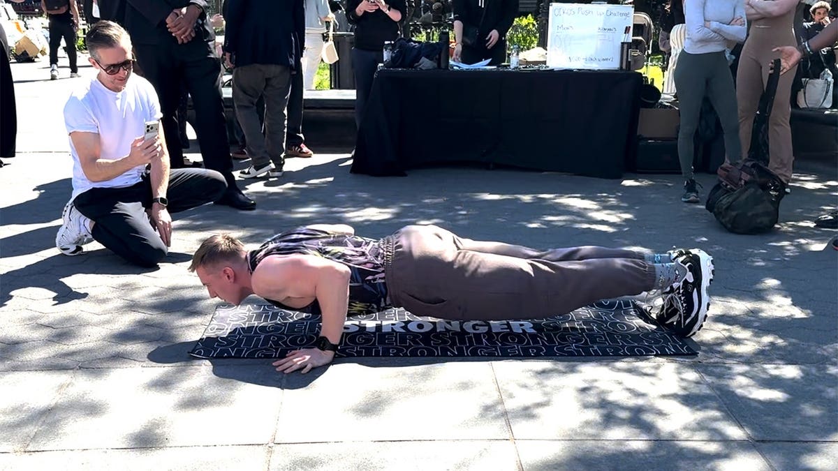 man does a pushup outside