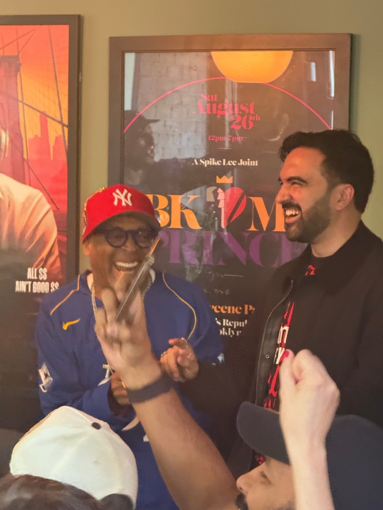 Spike Lee and Mamdani at Fancy Free in Brooklyn watching an Arsenal soccer game.