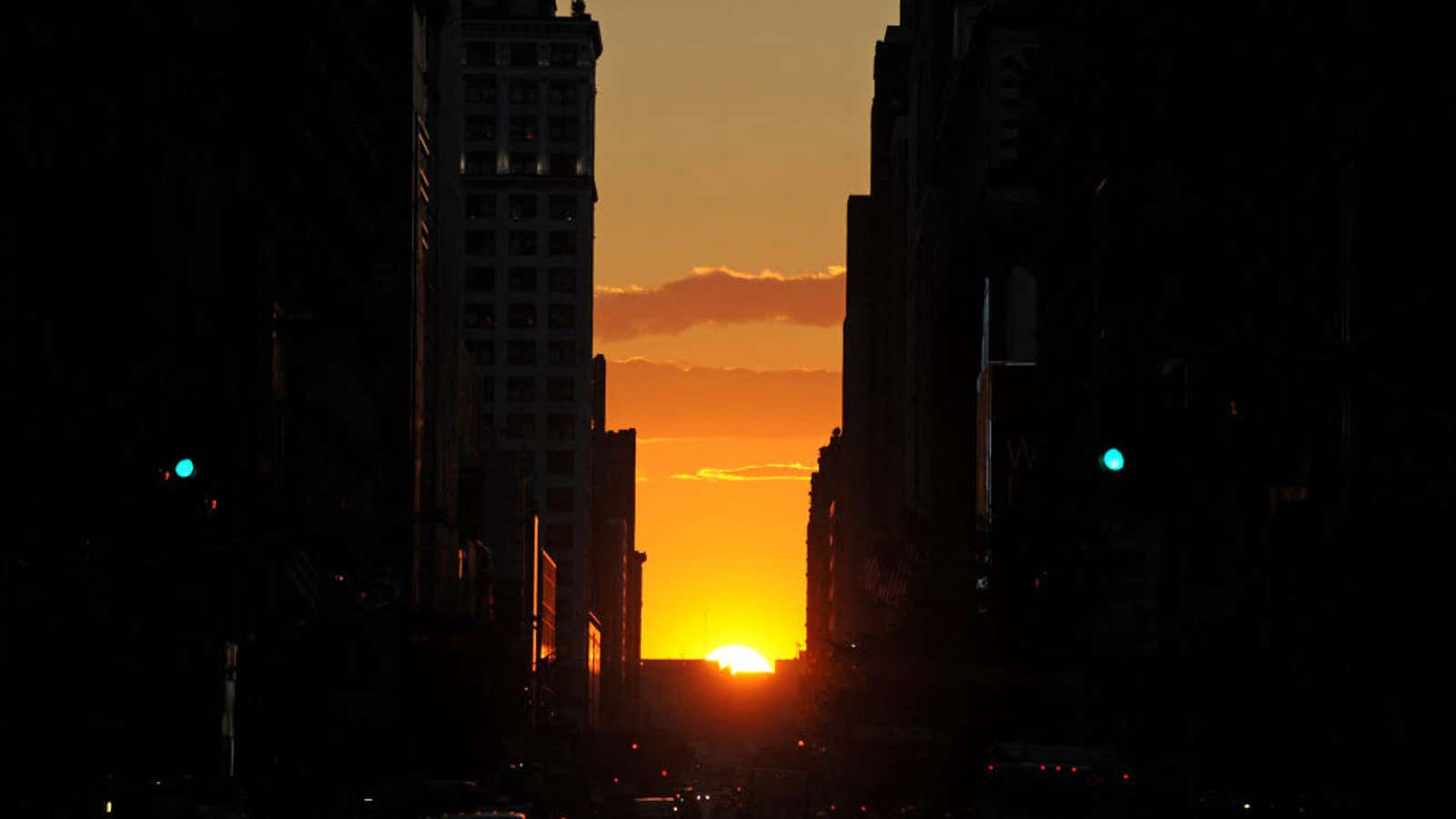 The sun sets along 34th Street, aligning with the Manhattan street grid during "Manhattanhenge"