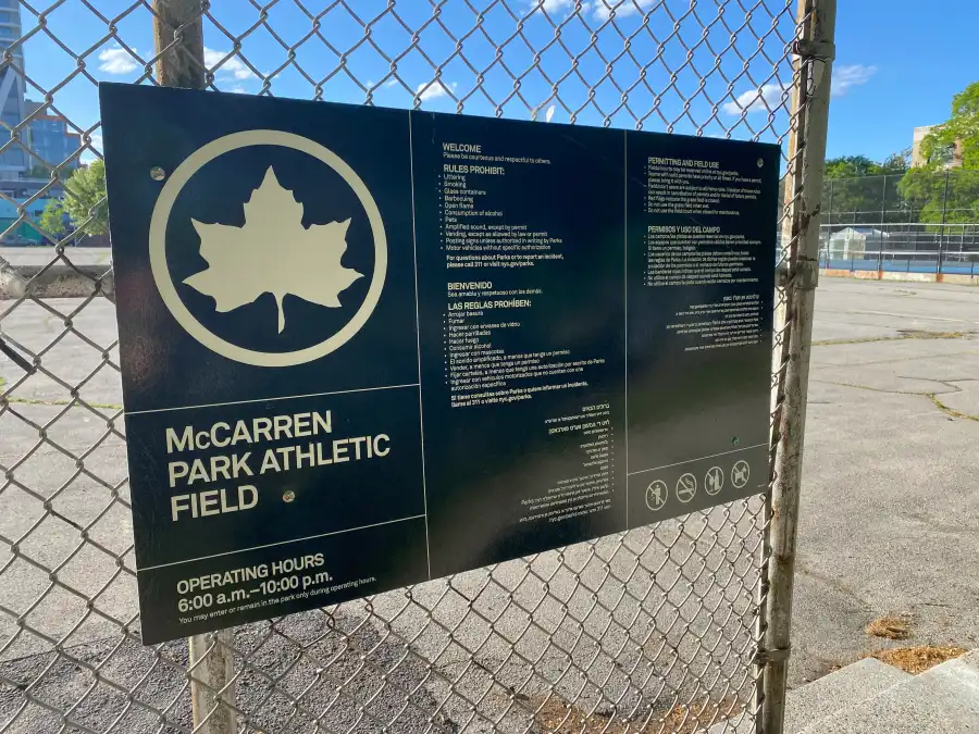 green parks sign for the mccarren park athletic field