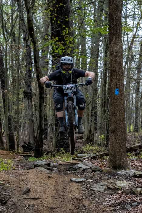 man on a bike in the woods