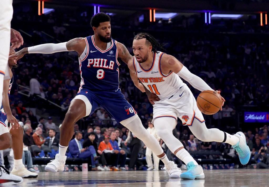 New York Knicks guard Jalen Brunson (11) drives to the basket as Philadelphia 76ers forward Paul George (8) defends.