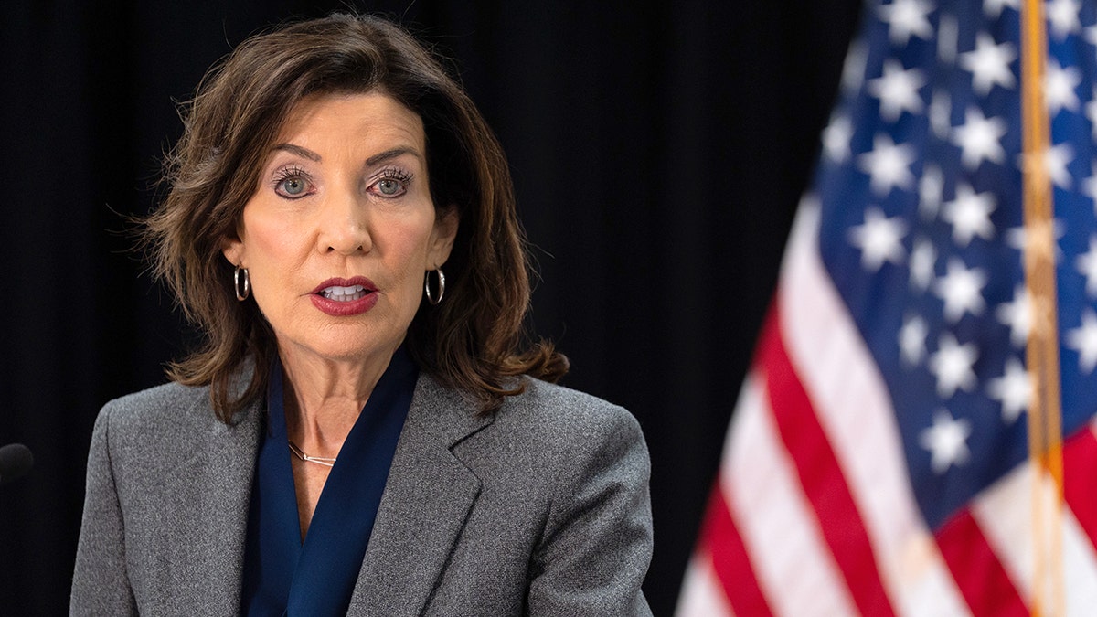 New York Gov. Kathy Hochul speaking at a news conference at WIN NYC family shelter