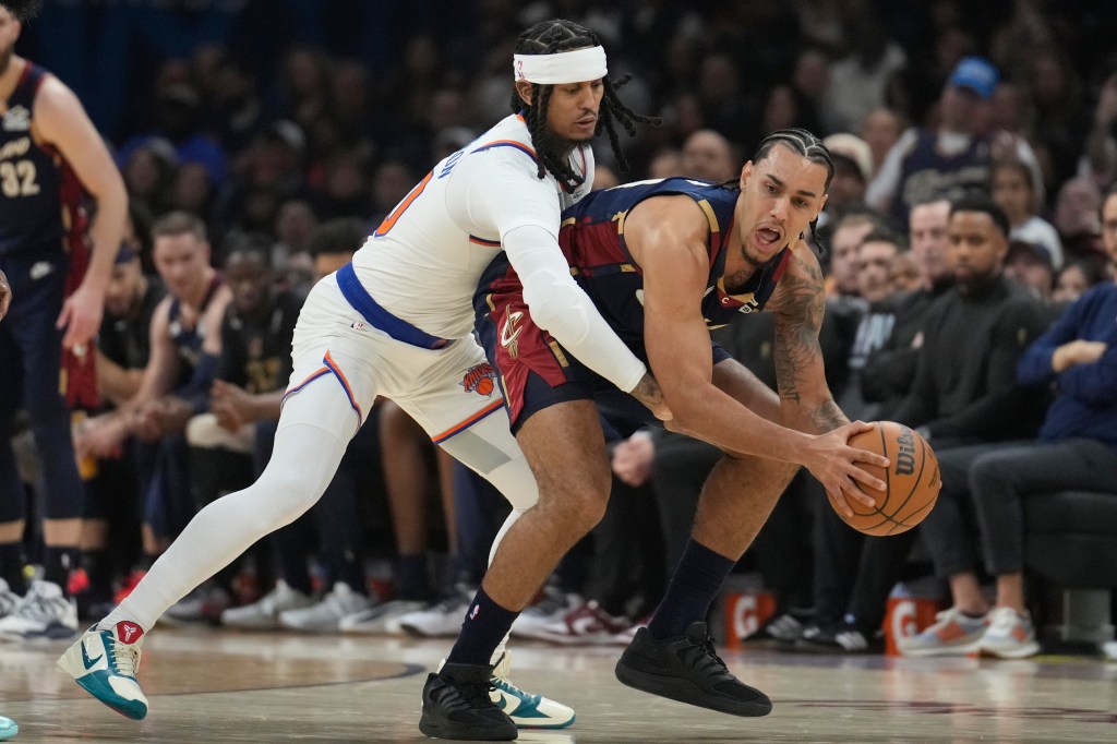 Jordan Clarkson defends Jaylon Tyson during an NBA game.