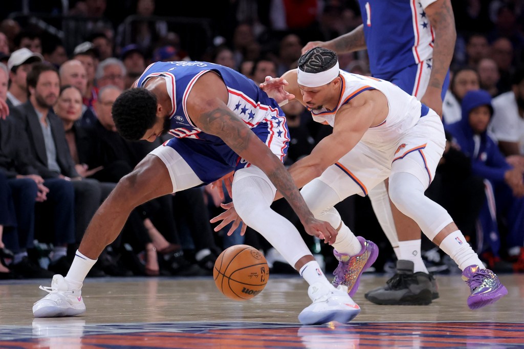 New York Knicks guard Josh Hart (3) strips the ball from Philadelphia 76ers forward Paul George (8).