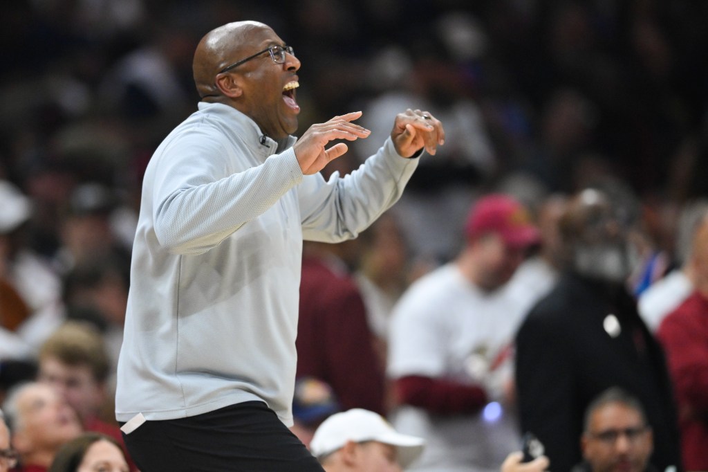 New York Knicks head coach Mike Brown reacting at an NBA game.