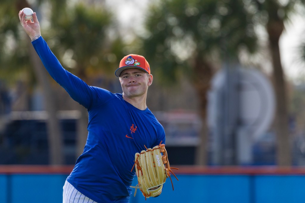 New York Mets’ A.J. Ewing throws a baseball during Spring Training.