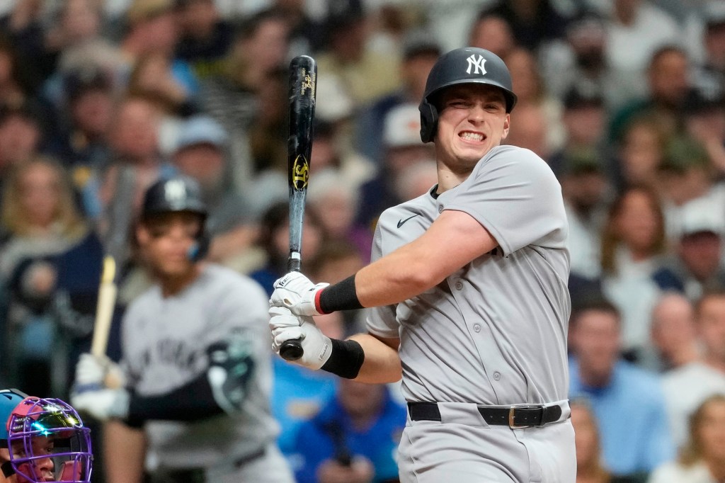 Ben Rice reacting after hitting a foul ball off himself during a baseball game.