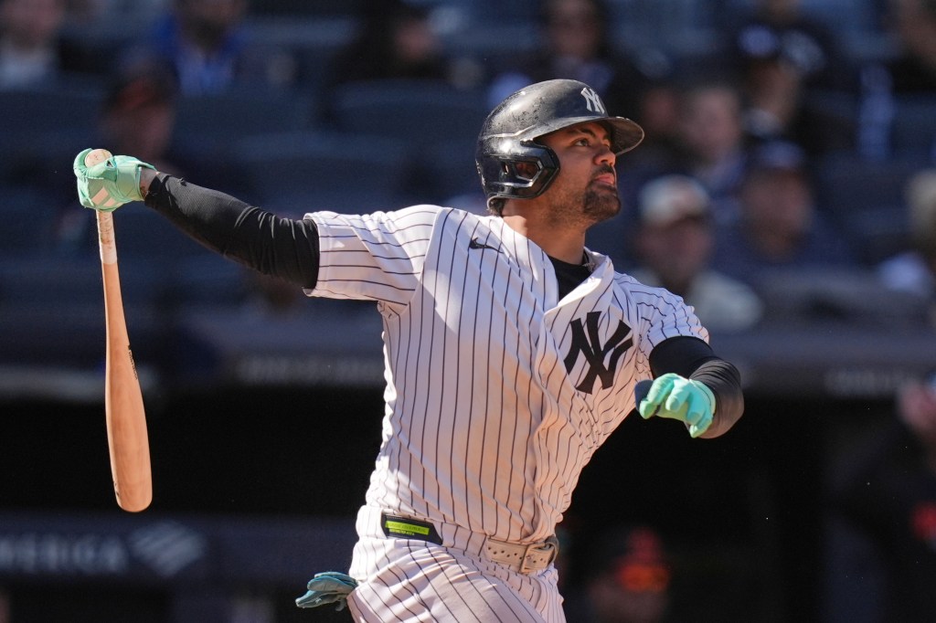 Jasson Domínguez of the New York Yankees looks on after hitting a two-run home run.