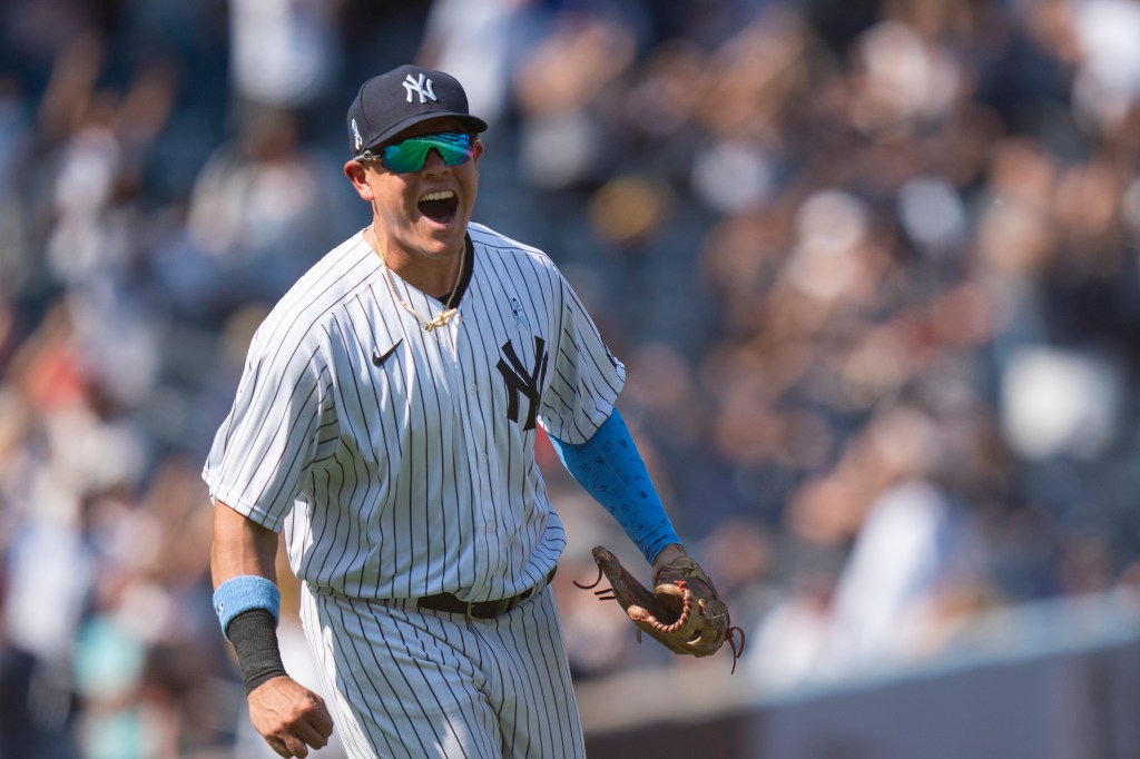 New York Yankees third baseman Gio Urshela celebrates a game ending triple play.