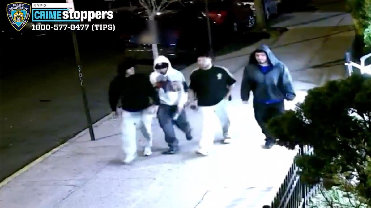 Four suspects walking in surveillance footage from NYPD