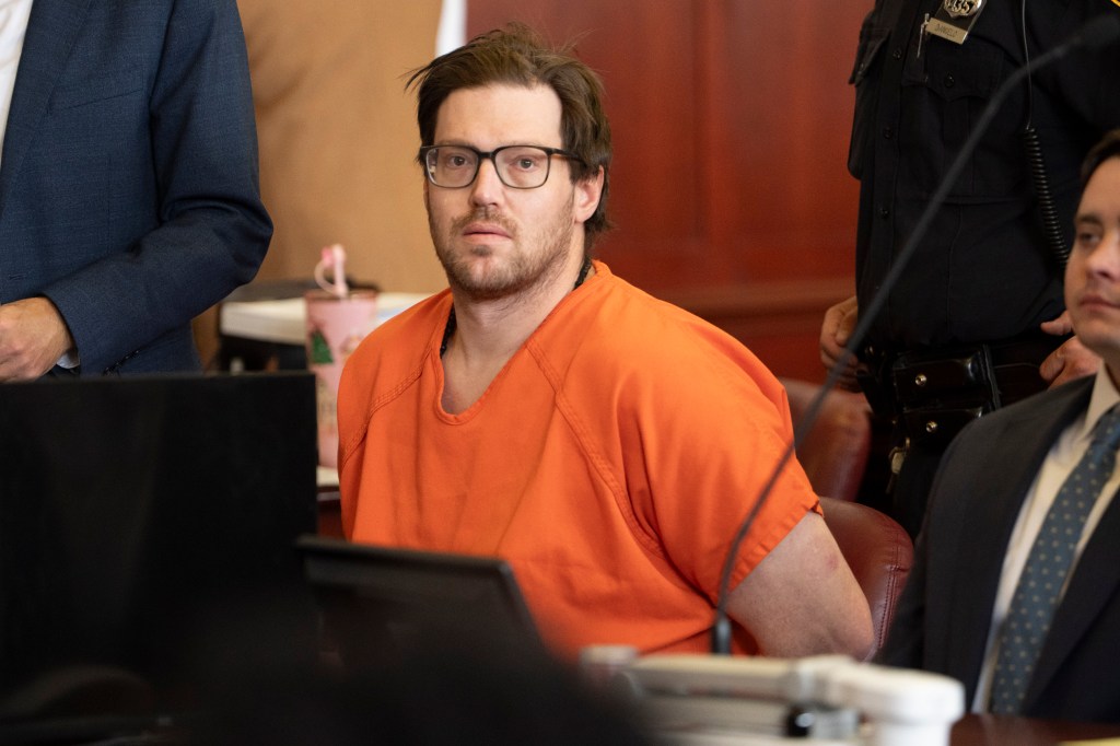 William Duplessie in orange prison clothes.