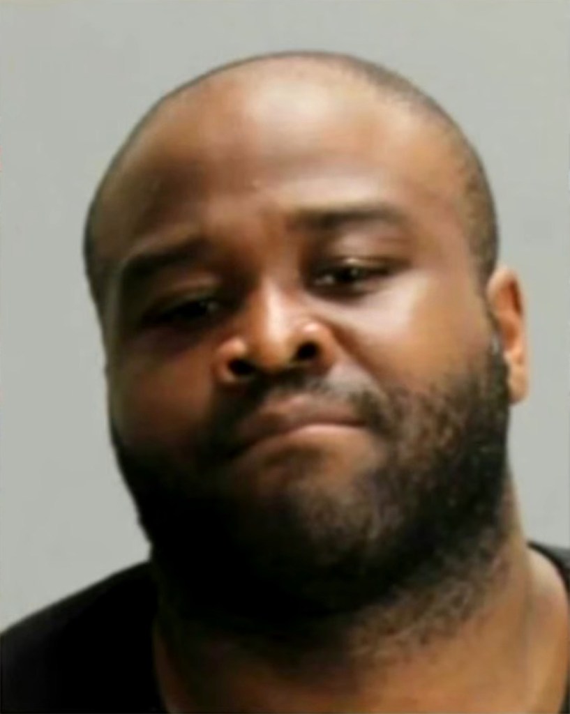 Mugshot of Oreoluwa Oloruntoba, a Black man with a receding hairline and beard, looking slightly down.