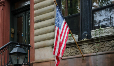 flag on a brownstone in park slope