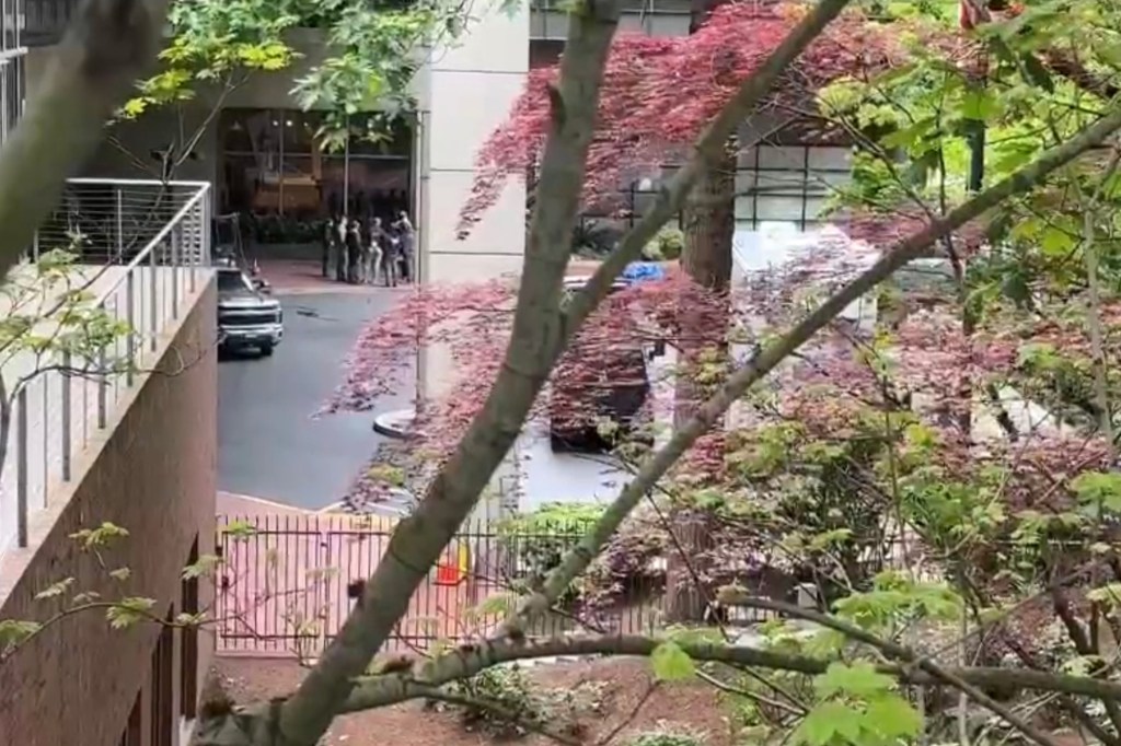 Police investigating the scene of a car crash into the Multnomah Athletic Club.