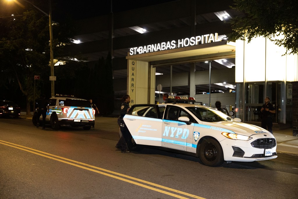 Police officers are seen at the scene of a shooting behind St. Barnabas Hospital in the Bronx on Quarry and Oak Tree Streets Tuesday, Sept. 2, 2025. Victim may have been shot at a different location. 