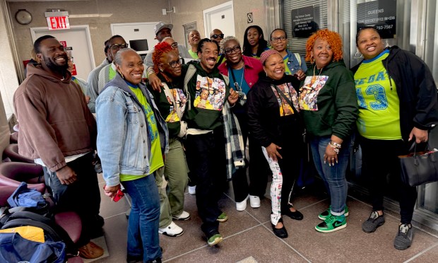 Family and friends of murder victim Robert Williams celebrate at Queens Criminal Court on Friday, May 22, 2026 after the sentencing of Richard Swygert. Shooting victim Jonathan Cato is pictured at far left. (Rebecca White / New York Daily News)
