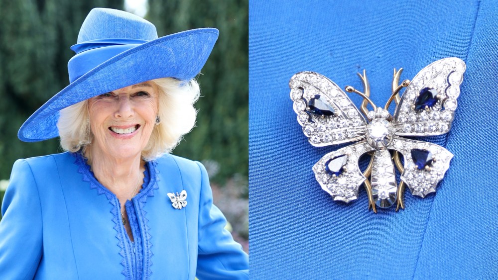 Queen Camilla wears a Fiona Clare dress and diamond and sapphire brooch at a Garden Party at Hillsborough Castle on May 20 in Hillsborough, Northern Ireland.