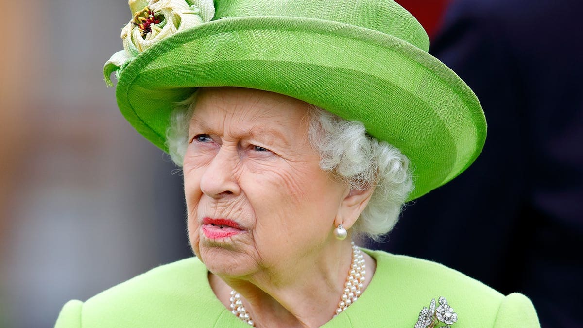 Queen Elizabeth II wearing a green dress and Vanguard Rose Brooch at Guards Polo Club in Egham