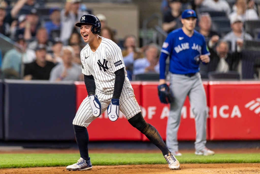 New York Yankees shortstop Anthony Volpe reacts after scoring a run.
