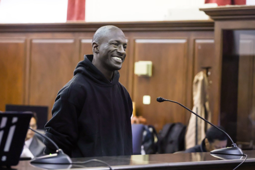 Rhamell Burke smiles during his arraignment in court.
