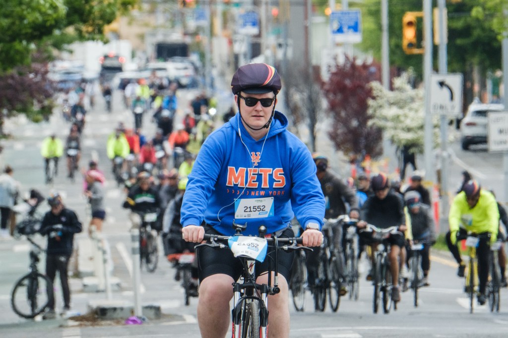 A Cyclist in a Mets hoodie world participating in the Annual Five Boro Bike Tour on May 3, 2026 in New York City.
