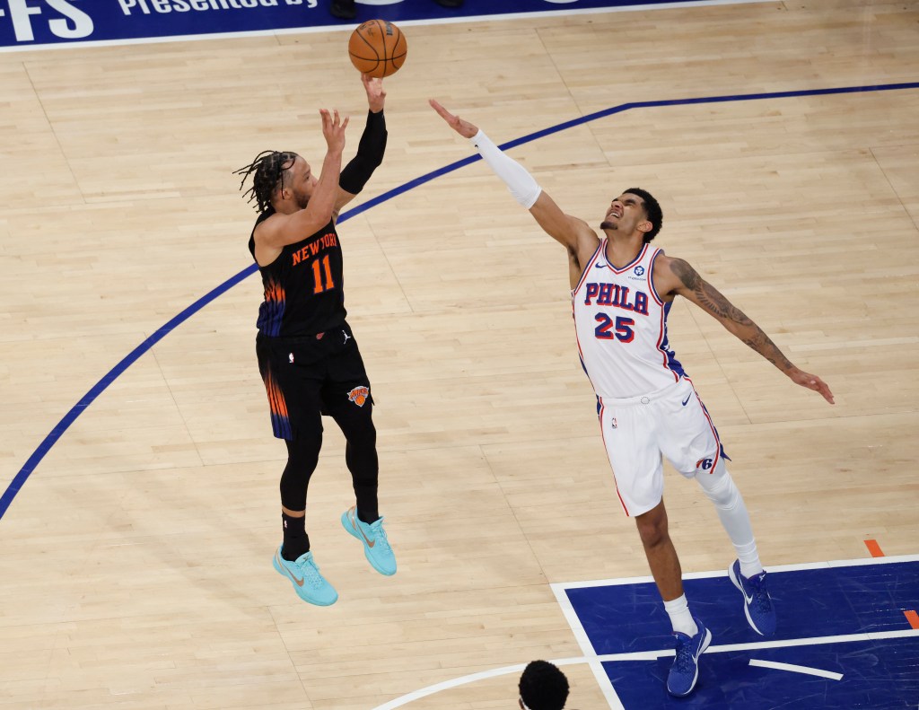 New York Knicks guard Jalen Brunson (11) shoots over Philadelphia 76ers forward Dominick Barlow (25).