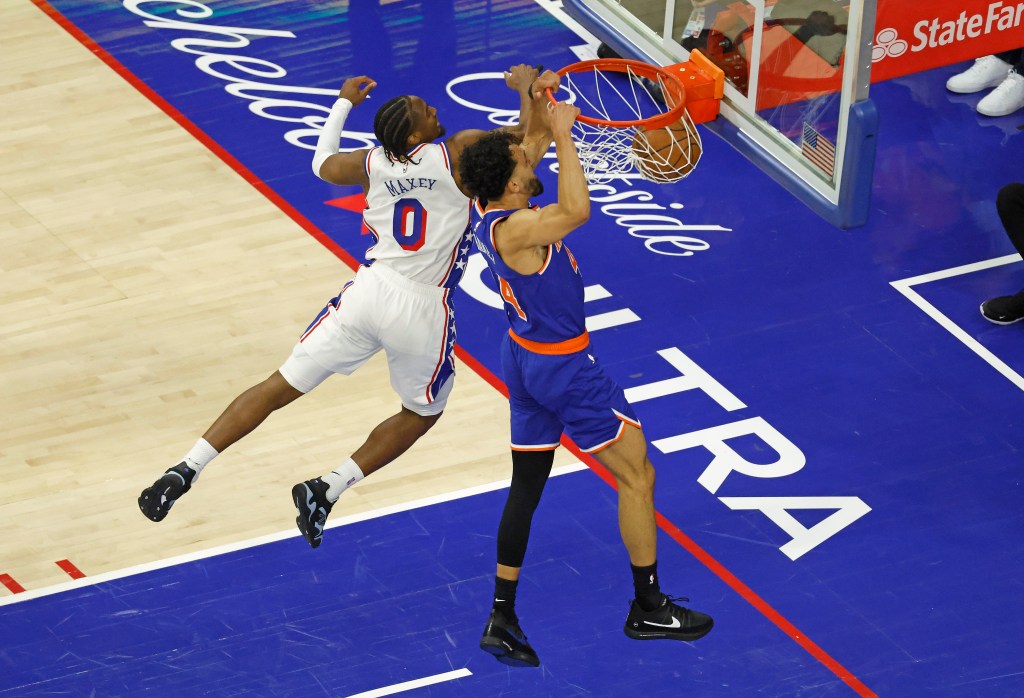 New York Knicks guard Landry Shamet (44) slamming the ball over Philadelphia 76ers guard Tyrese Maxey (0).
