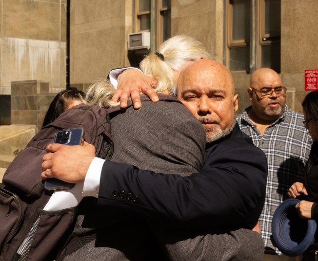 Harry Ruiz (right) hugs his attorney, Ron Kuby, outside Manhattan Supreme Court on Monday, April 27, 2026, after a judge vacated Ruiz's decades-old murder conviction on the grounds of newly discovered evidence that was suppressed by former prosecutors for the Manhattan district attorney's office. (Molly Crane-Newman / New York Daily News)
