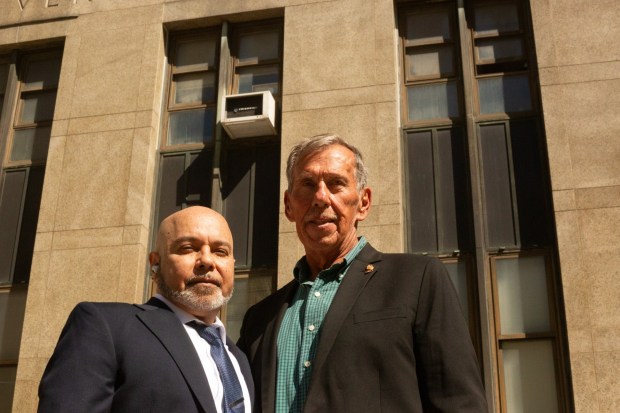 Harry Ruiz (left) is pictured outside Manhattan Supreme Court on Monday, April 27, 2026, next to Mike Race, who pursued evidence that helped clear Ruiz's name. (Molly Crane-Newman / New York Daily News)
