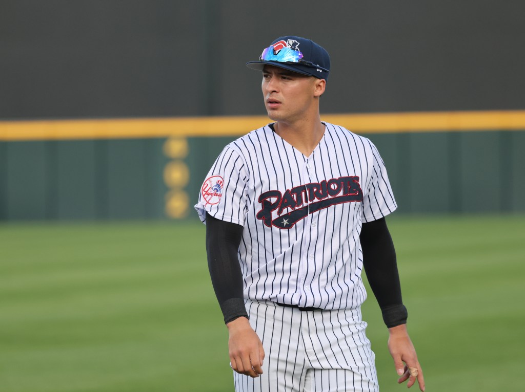 Somerset Patriots player Anthony Volpe #7 warming up on the field.