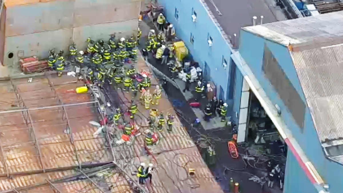 Scene of explosion with firefighters/EMS