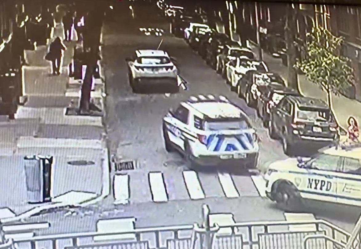 Police cars can be seen following an allegedly-stolen 2026 Hyundai SUV on Orange Street in Brooklyn Heights. Photo: Private residence surveillance