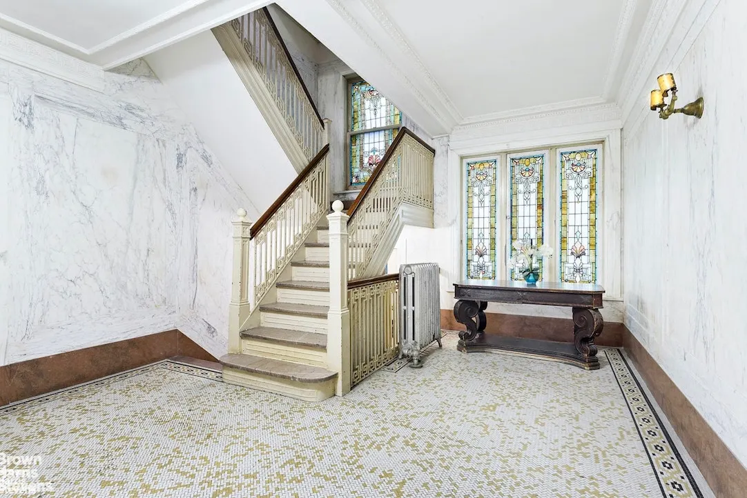 building hallway with tile floor and stained glass window
