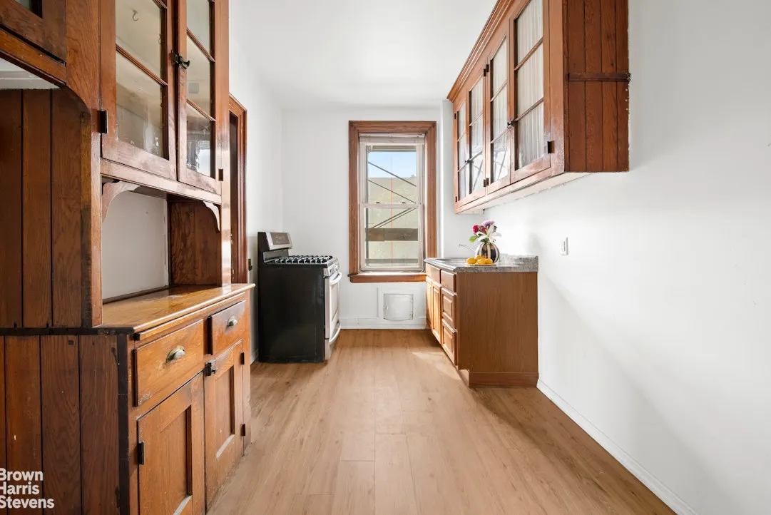 kitchen with some original cabinets, a black stove