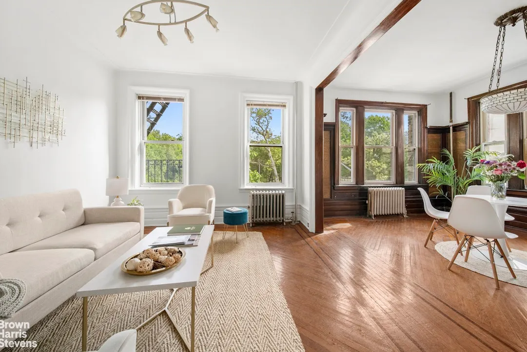 sunset park living room with view into a dining room with wainscoting