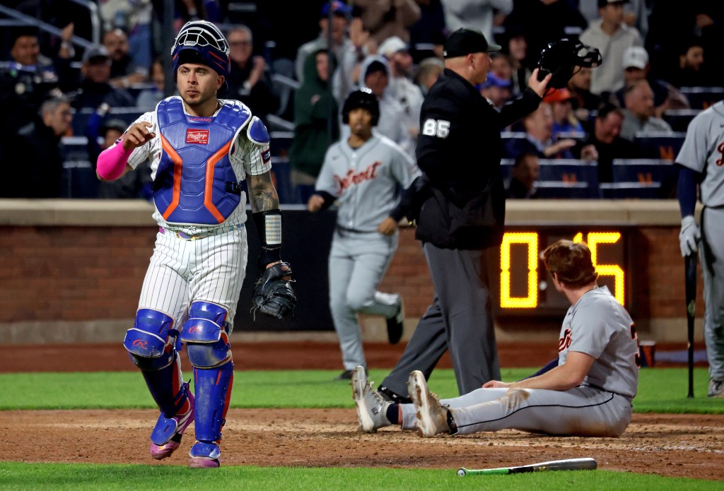 New York Mets catcher Francisco Alvarez (4) tags out Detroit Tigers third baseman Colt Keith (33) on a play at the plate ending the fifth inning.
