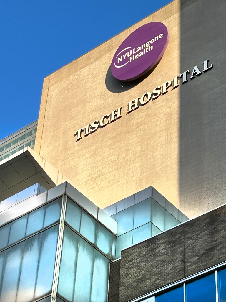Exterior of Tisch Hospital, part of NYU Langone Health, with its name and logo visible.
