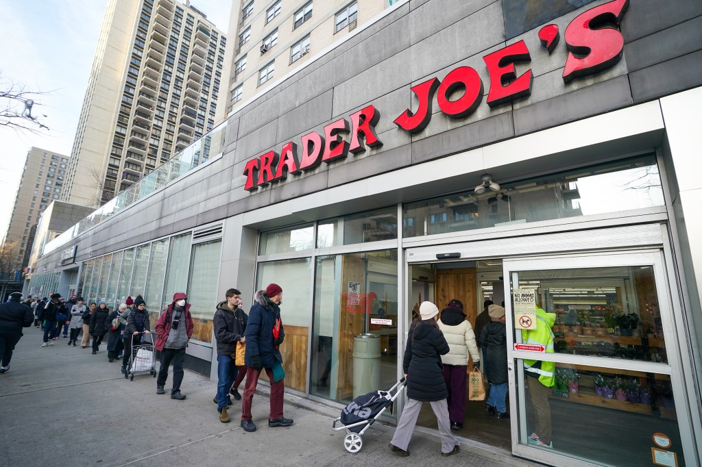 A line of shoppers outside of a Trader Joe's grocery store in Manhattan.