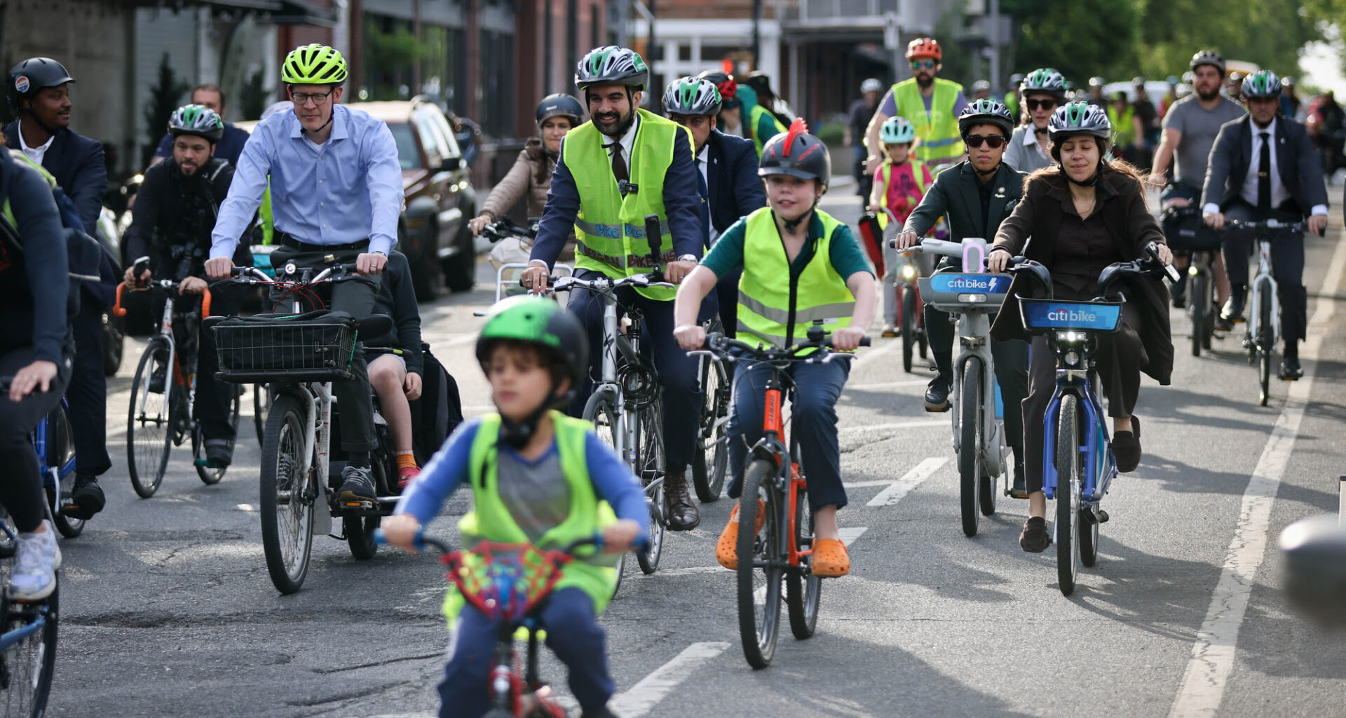 Mayor Mamdani and DOT head Mike Flynn bike to school with the Bergen Bike Bus. Photo: NYC DOT.
