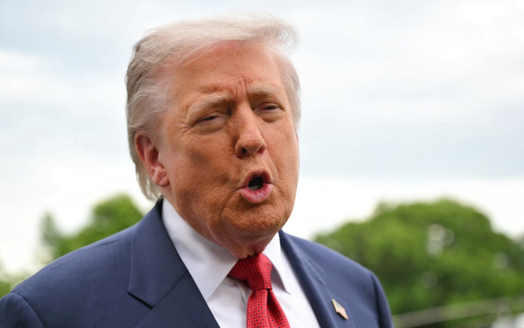 Former US President Donald Trump speaks to journalists before boarding Marine One.