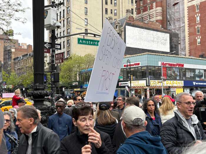 protestors outside holding signs