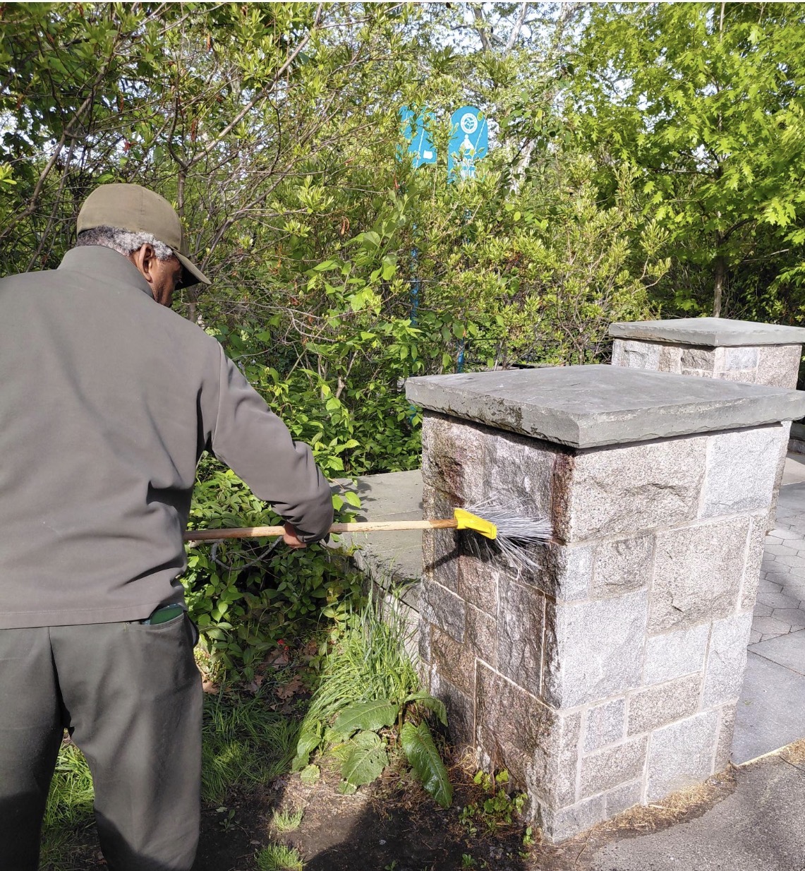 Park Supervisor Paul Malcolm at Highland Park uses graffiti remover, to wash away the graffiti. 