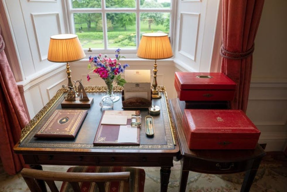 View of a desk, overlooking a garden