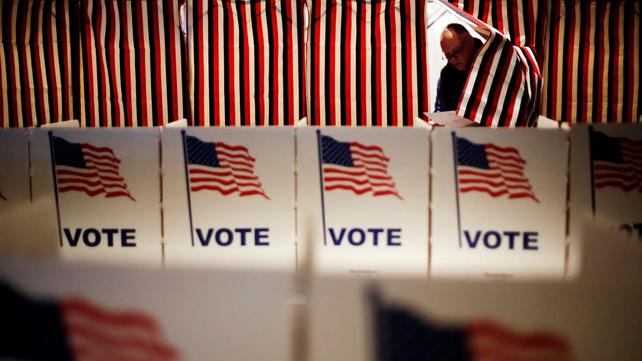 person coming out of voting booth