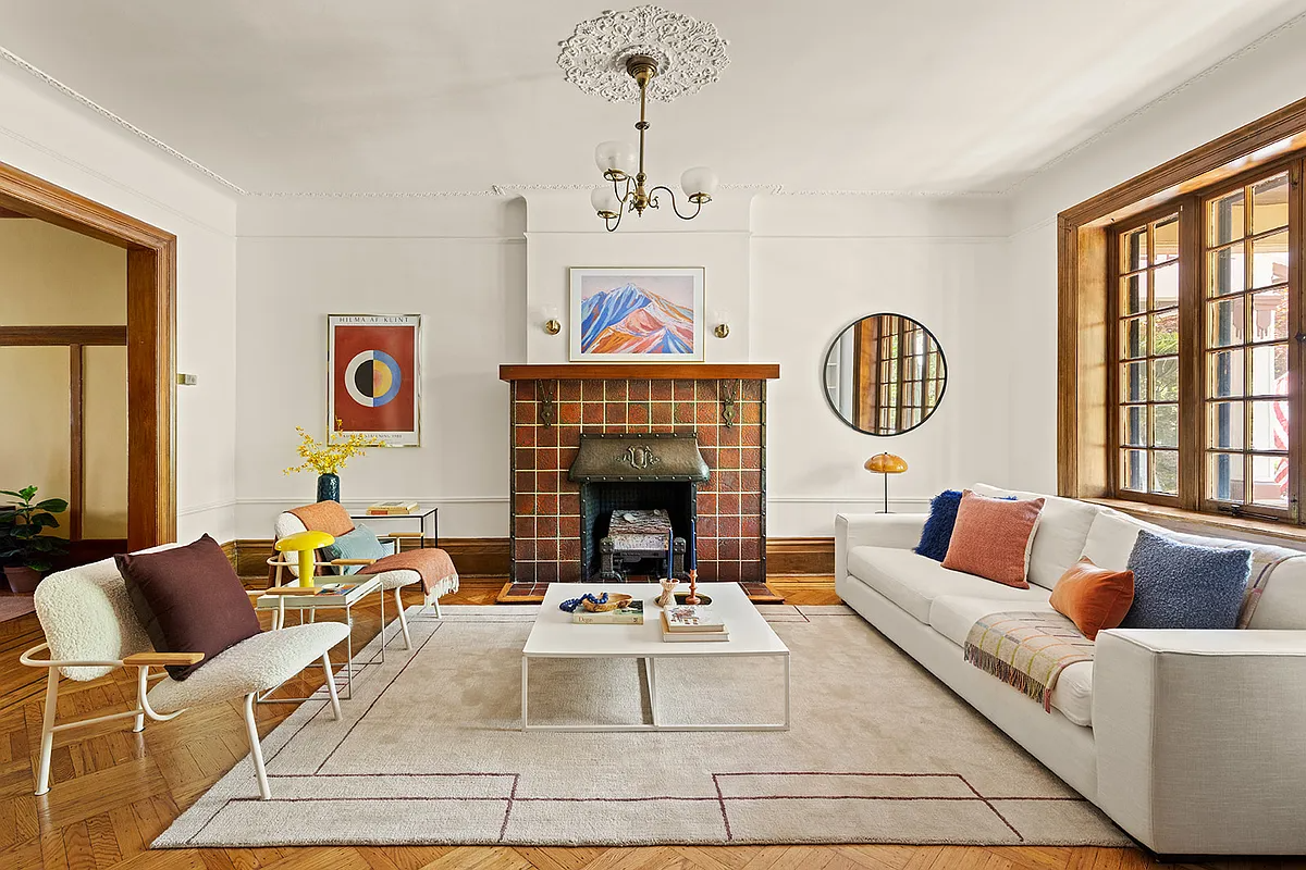 parlor with tile mantel, wood floor