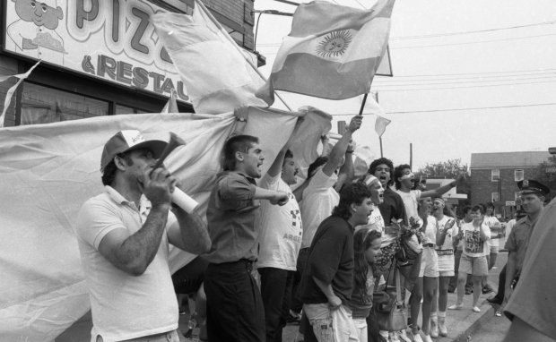 Argentine soccer fans in Corona, Queens shout, "We came in second!" after their loss in the World Cup Final on July 8, 1990.